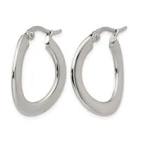 A pair of polished silver-toned oval hoop earrings with a curved, tubular design and hinged posts, displayed against a white background.