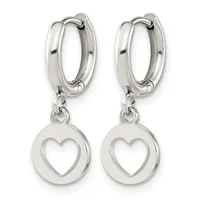 Pair of silver-toned huggie hoop earrings with circular heart-shaped pendants hanging from hinged closures.