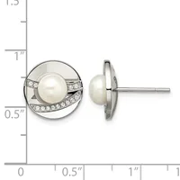 Pair of silver stud earrings featuring white pearl centers surrounded by diamond accents in circular settings, shown front and side view against a measurement scale.