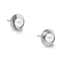 Pair of silver stud earrings with white pearl centers surrounded by polished silver discs and diagonal diamond accents on posts.