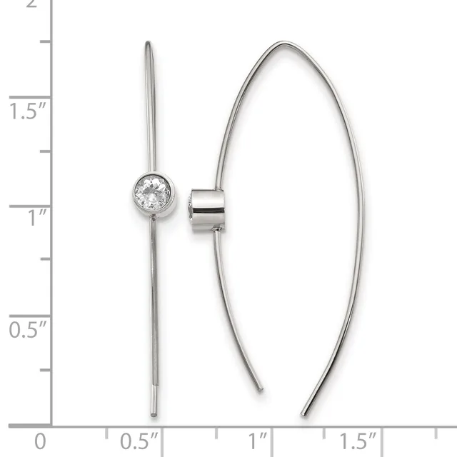 Two silver earrings displayed against a ruler showing measurements up to 2 inches: one linear drop earring with a round faceted stone at top, and one curved open hoop earring with a cylindrical connector.