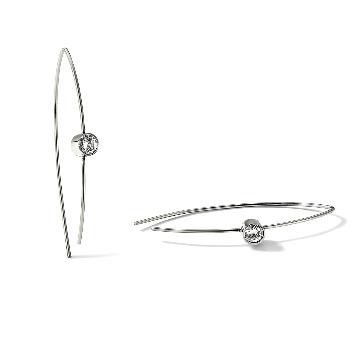Two silver wire earrings with small round faceted gemstones, one pair with long curved threader wires and one pair with shorter curved hoop wires.
