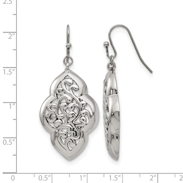 A pair of silver filigree dangle earrings with ornate quatrefoil pendants shown front and side view against a measurement scale.