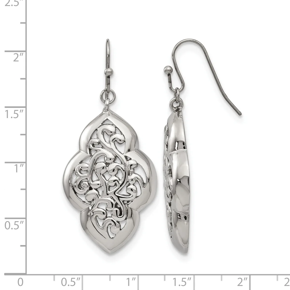 A pair of silver filigree dangle earrings with ornate quatrefoil pendants shown front and side view against a measurement scale.