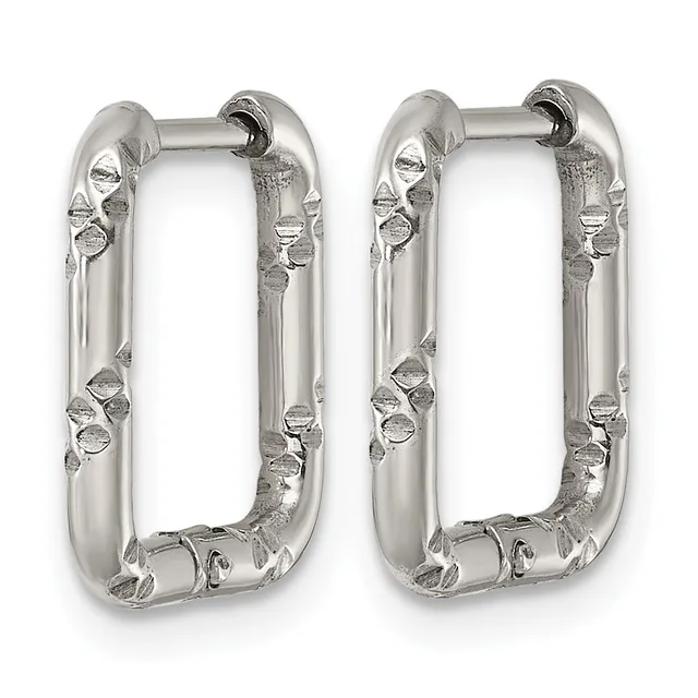 A pair of silver rectangular hoop earrings with textured surfaces featuring small circular and geometric embellishments along the sides.