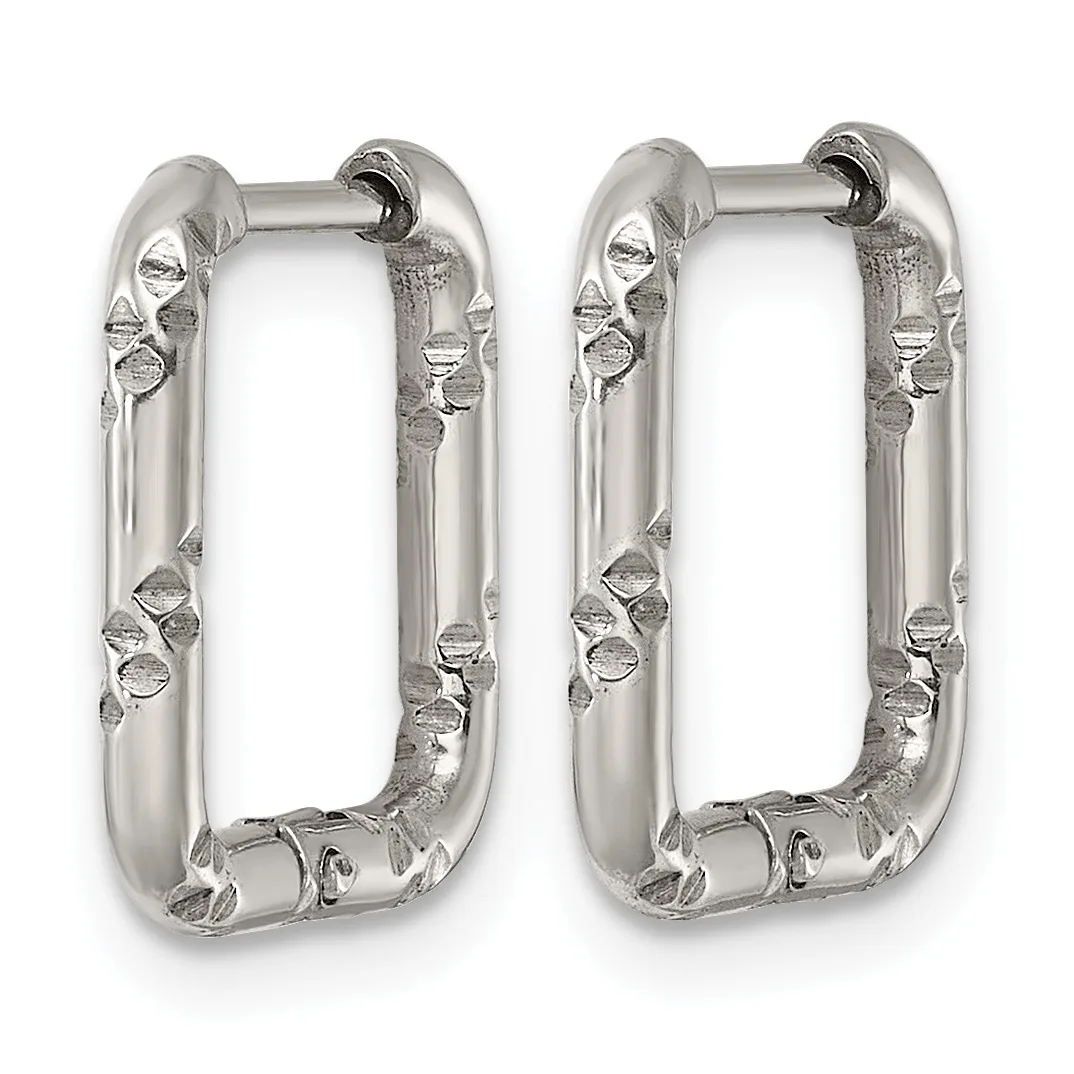 A pair of silver rectangular hoop earrings with textured surfaces featuring small circular and geometric embellishments along the sides.