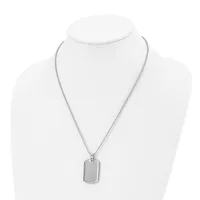 A silver-toned rectangular dog tag pendant hangs from a thin chain on a white mannequin bust.