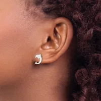 A person wearing a silver chunky curved hoop earring in their earlobe, shown in profile against their shoulder.
