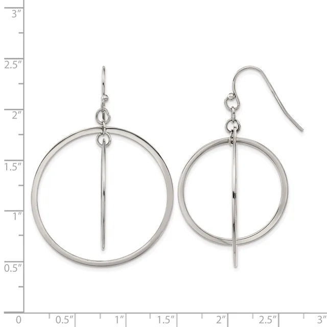 Pair of silver-toned dangle earrings with circular frames and vertical bar details, displayed on a measurement scale.