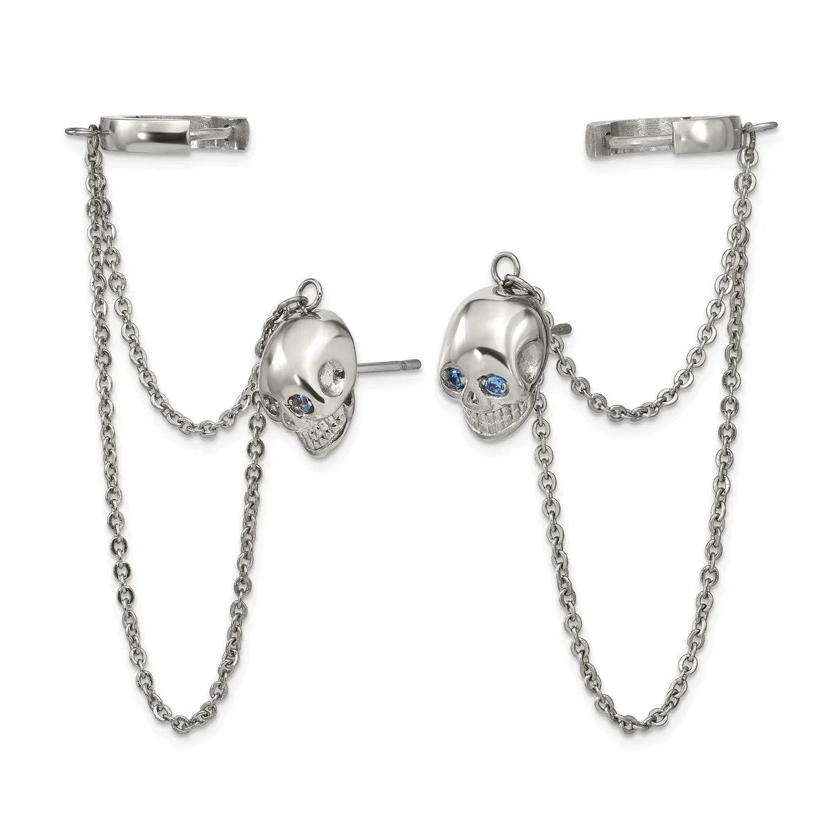 Silver skull stud earrings with blue stone eyes connected by chain drapes to bar ear cuffs.