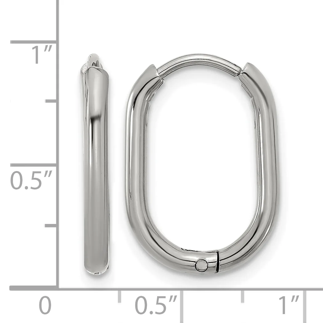Two silver-toned oval hoop earrings displayed next to a ruler showing approximately one inch in length and half inch in width.