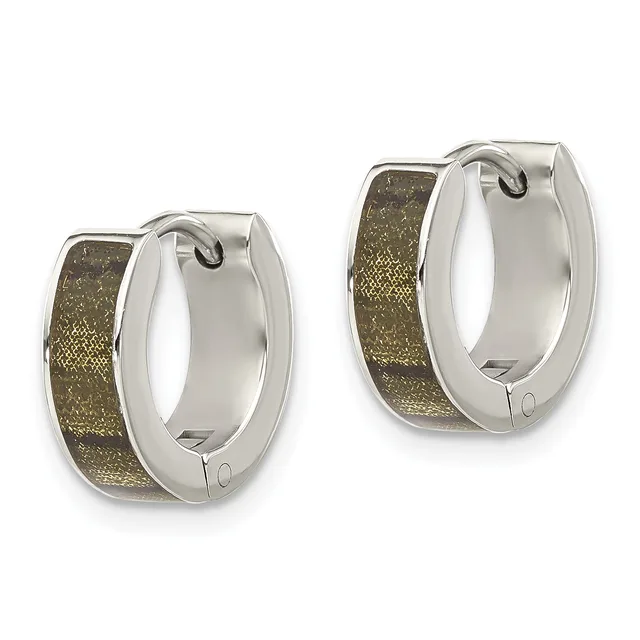 A pair of silver-toned hoop earrings with textured gold-colored inlay on the outer surface and a small hallmark on the clasp.