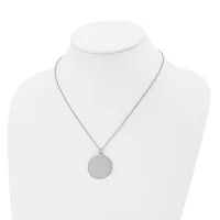 A silver-toned circular pendant necklace displayed on a white bust form mannequin.