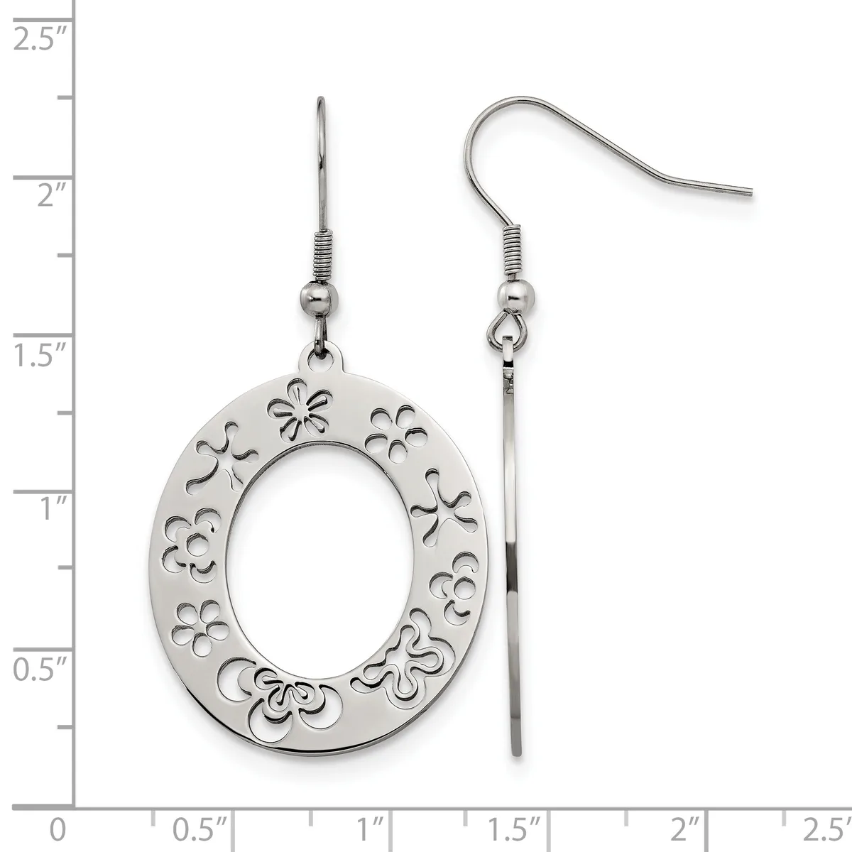 A pair of silver dangle earrings with oval pendants featuring decorative cutout floral patterns, displayed against a measurement ruler.