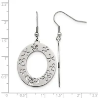 A pair of silver dangle earrings with oval pendants featuring decorative cutout floral patterns, displayed against a measurement ruler.