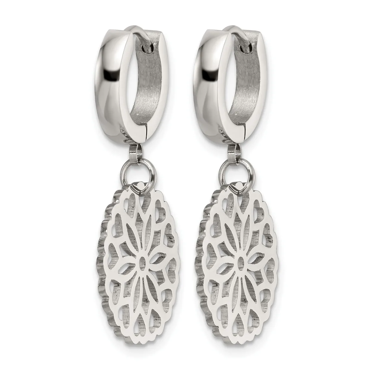 A pair of silver huggie hoop earrings with ornate oval filigree pendants featuring a floral cutout design.