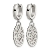 A pair of silver huggie hoop earrings with ornate oval filigree pendants featuring a floral cutout design.