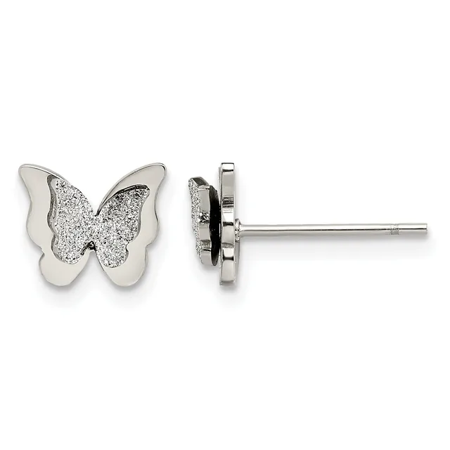 A pair of silver butterfly stud earrings with glitter-textured wings and polished outer edges, shown from front and side views.
