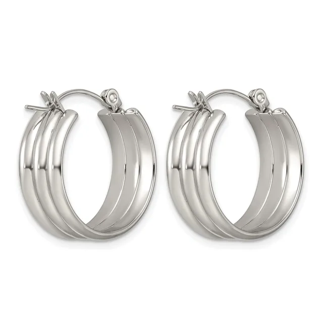 A pair of polished silver-toned hoop earrings with triple grooved bands and hinged posts, displayed side by side.