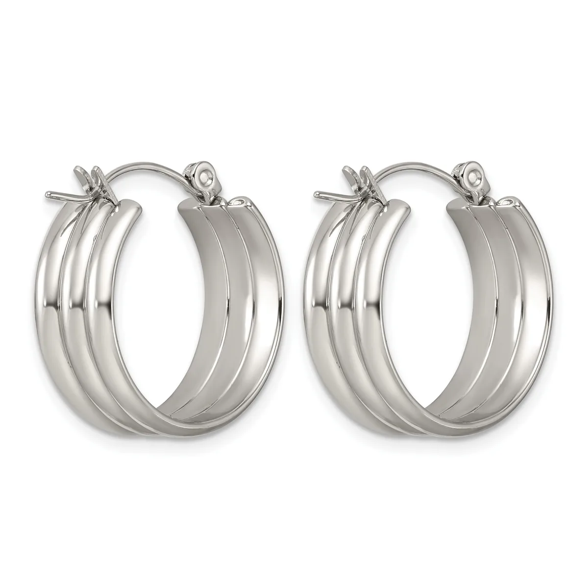 A pair of polished silver-toned hoop earrings with triple grooved bands and hinged posts, displayed side by side.