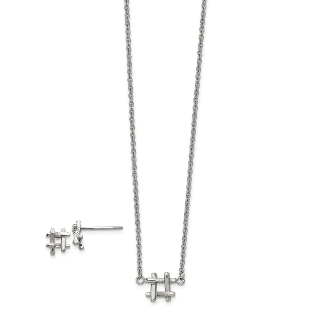 Silver-toned puzzle piece necklace and matching stud earrings displayed on a white background.