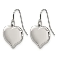 A pair of polished silver heart-shaped drop earrings with curved fish hook wires against a white background.