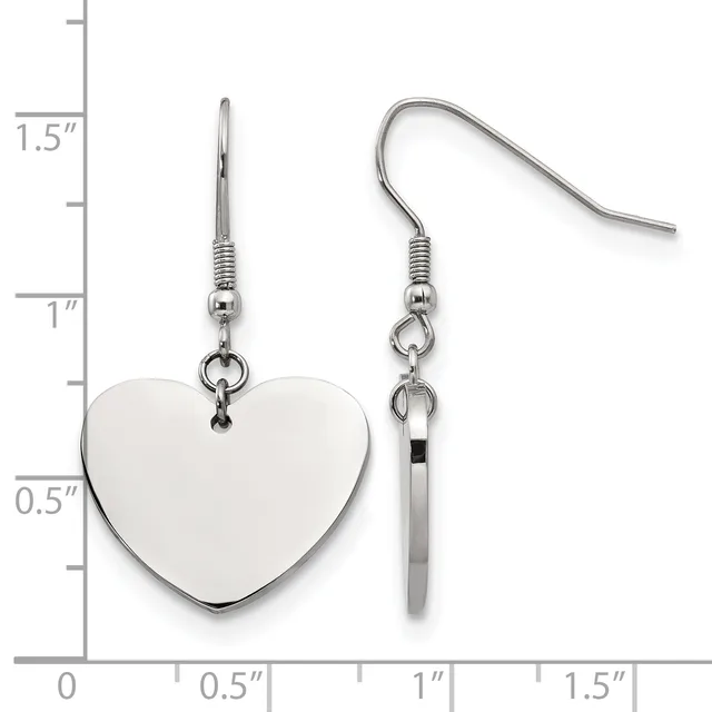Pair of silver-toned dangle earrings with polished heart-shaped charms and matching cylindrical bead accents, displayed against a measurement scale.