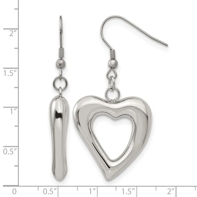 A pair of silver-toned dangle earrings with fish hook closures, one featuring an elongated teardrop shape and the other a hollow heart outline, displayed against a ruler showing measurements up to 2 inches.