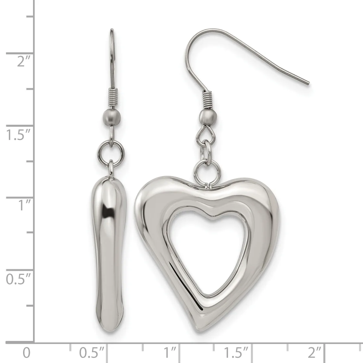 A pair of silver-toned dangle earrings with fish hook closures, one featuring an elongated teardrop shape and the other a hollow heart outline, displayed against a ruler showing measurements up to 2 inches.