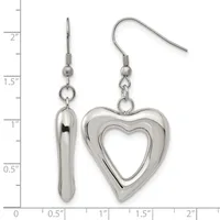 A pair of silver-toned dangle earrings with fish hook closures, one featuring an elongated teardrop shape and the other a hollow heart outline, displayed against a ruler showing measurements up to 2 inches.