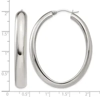 A pair of polished silver-toned oval hoop earrings shown from front and side views with a measurement scale indicating approximately two inches in height.