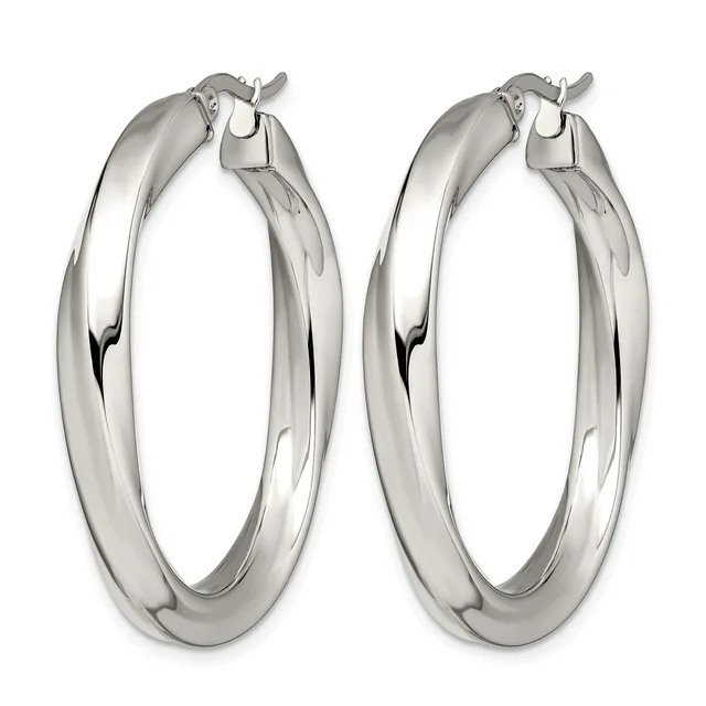 A pair of polished silver-toned hoop earrings with a chunky, tubular design and hinged closures, shown from above.