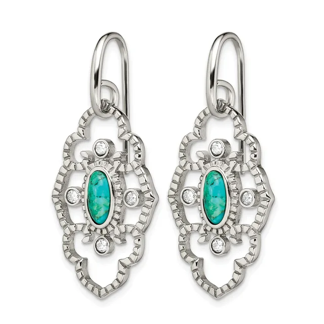 A pair of ornate silver drop earrings featuring turquoise oval stones surrounded by circular diamond accents and decorative filigree metalwork.