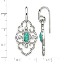 Pair of silver earrings with ornate filigree designs featuring turquoise oval cabochons in the center and round white stone accents, shown front and back views with a measurement scale.