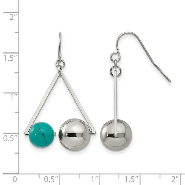 A pair of silver-tone earrings displayed on a ruler showing measurements up to two inches, with the left earring featuring a triangular frame suspending a turquoise bead and silver sphere, and the right earring showing a similar design with two silver spheres.