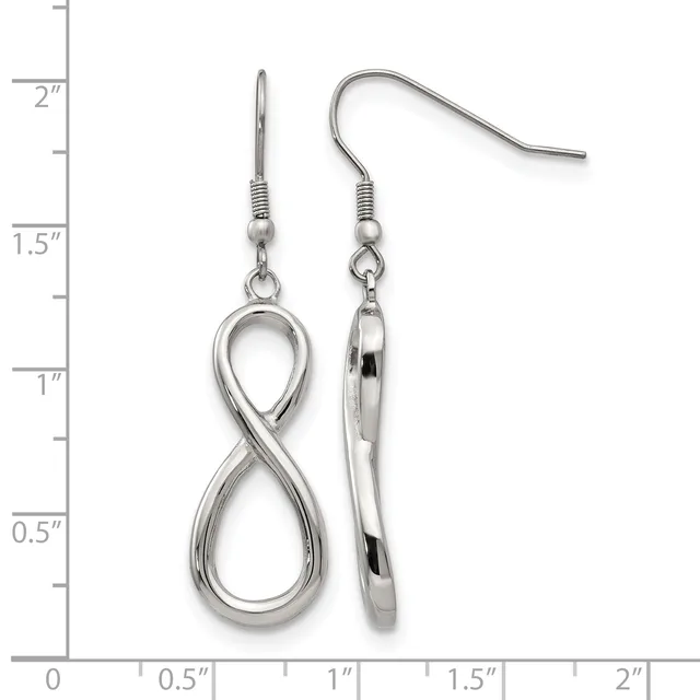 A pair of silver-toned infinity symbol dangle earrings with fish hook ear wires, displayed next to a ruler showing approximately two inches in length.