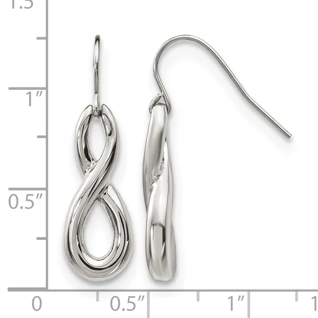 A pair of polished silver-colored dangle earrings with looped infinity-shaped pendants, shown against a measurement ruler indicating approximately one inch in length.