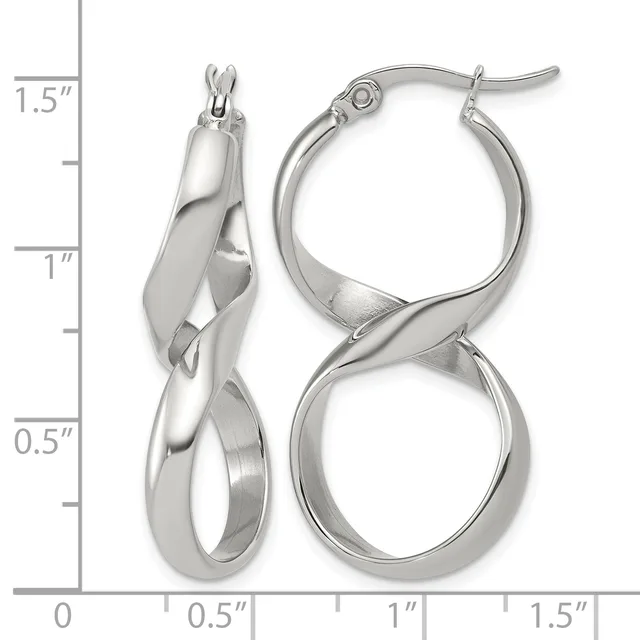A pair of polished silver-toned twisted hoop earrings displayed next to a ruler showing they measure approximately 1.5 inches in length.