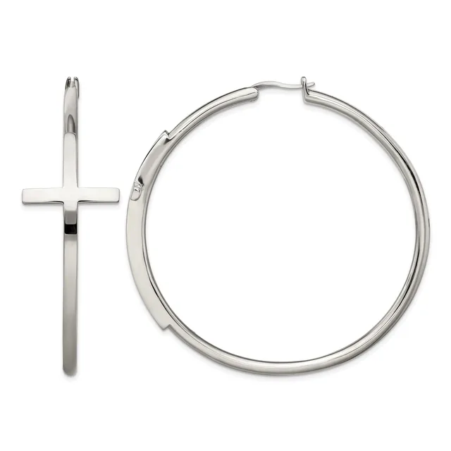 A pair of polished silver-toned hoop earrings with a cross charm attached to one hoop, displayed against a white background.