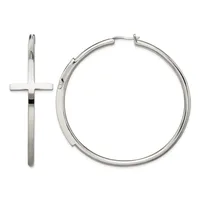 A pair of polished silver-toned hoop earrings with a cross charm attached to one hoop, displayed against a white background.