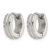 Pair of silver-toned chunky hoop earrings with glittery textured outer surfaces and smooth inner bands, shown from the front.