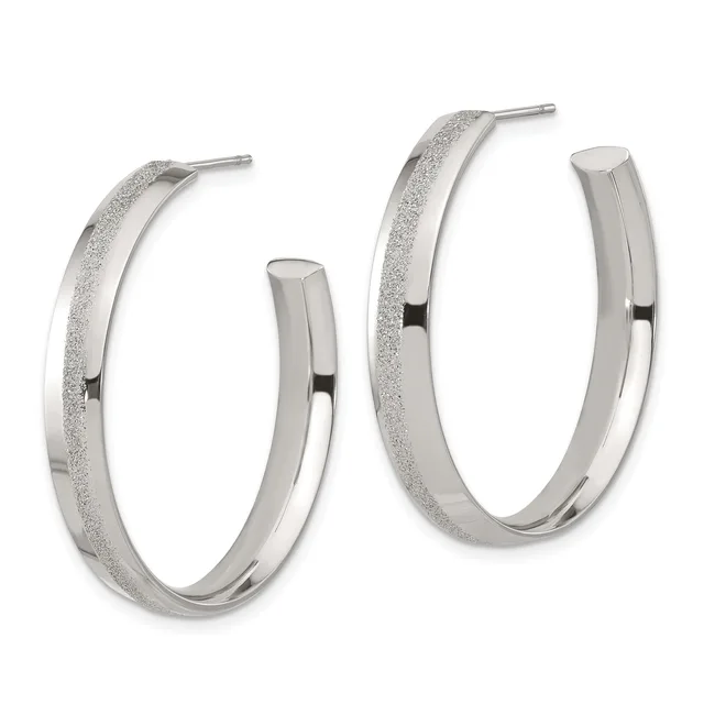 Pair of silver hoop earrings with textured frosted surface on the outer half and polished finish on the inner half, shown from the front against a white background.