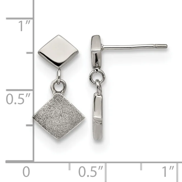 A pair of silver drop earrings with polished square tops and textured square bottoms connected by small links, displayed against a ruler showing approximately one inch in length.