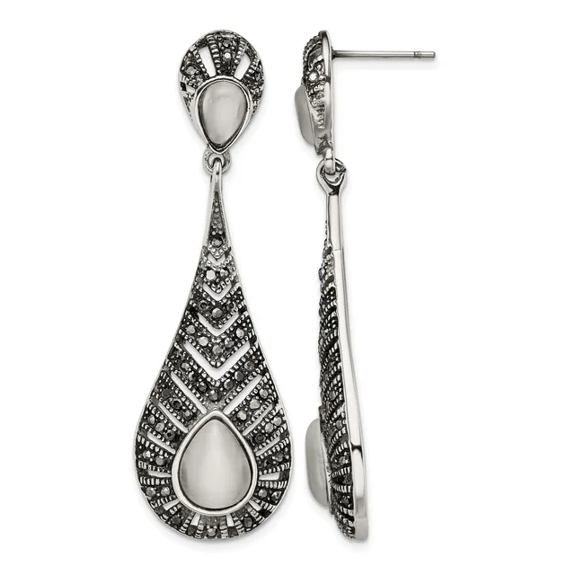 Pair of sterling silver drop earrings with teardrop-shaped mother-of-pearl centers surrounded by marcasite detailing, shown from front and side views.