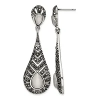 Pair of sterling silver drop earrings with teardrop-shaped mother-of-pearl centers surrounded by marcasite detailing, shown from front and side views.
