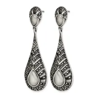 A pair of silver teardrop earrings with pearl centers and ornate filigree detailing throughout, shown against a white background.