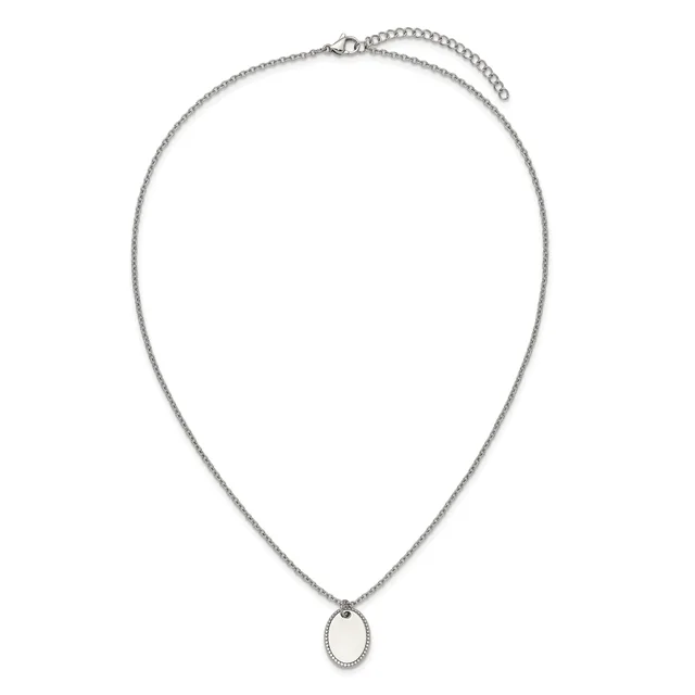 A silver-toned chain necklace with an adjustable length and a small oval pendant featuring a dotted border design.