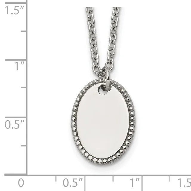 Oval stainless steel pendant with beaded border on chain necklace, shown with ruler for scale.