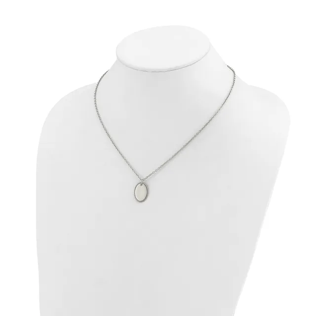A silver-toned chain necklace with a small oval pendant featuring a pale stone or mother-of-pearl center, displayed on a white mannequin bust.