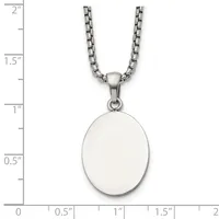 Silver-toned stainless steel necklace with a polished oval pendant, shown against a ruler measuring approximately 1.25 inches in length.